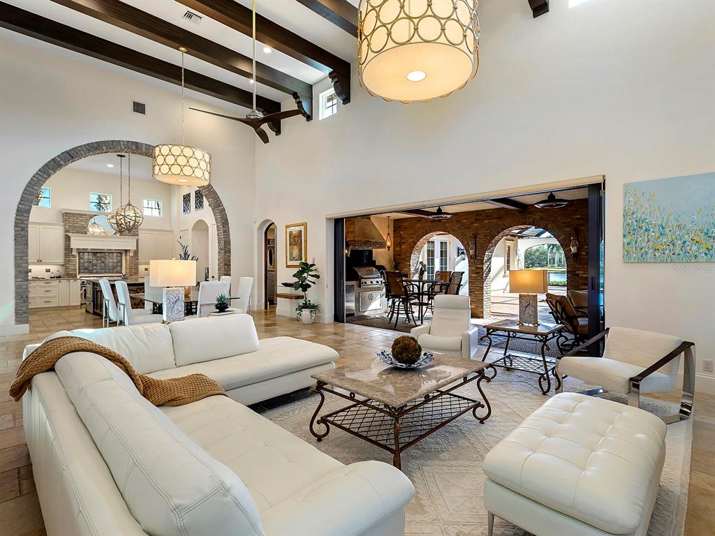 7951 Matera Court Lakewood Ranch, FL 34202 - Photo 15 of 81 a living room with furniture and a large window