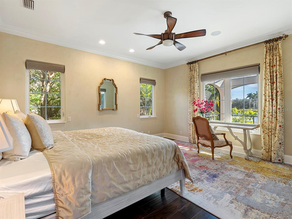 7951 Matera Court Lakewood Ranch, FL 34202 - Photo 28 of 81 a bedroom with a bed window and a dresser