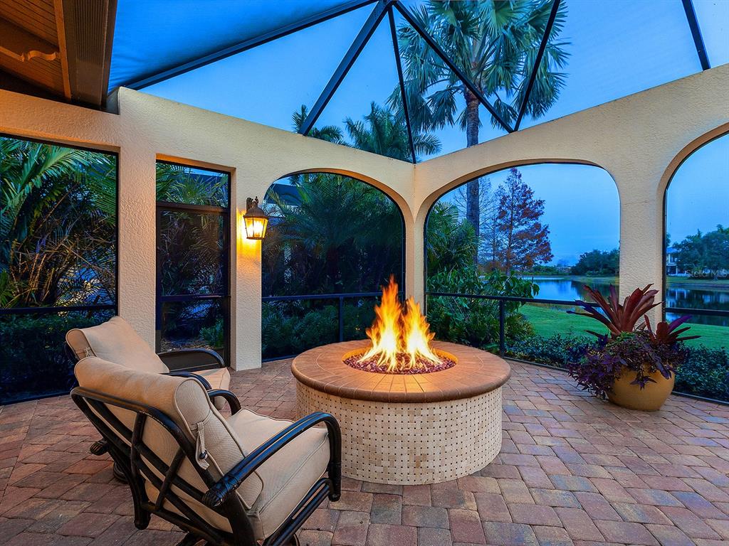 7951 Matera Court Lakewood Ranch, FL 34202 - Photo 3 of 81 a view of a patio with a table and chairs
