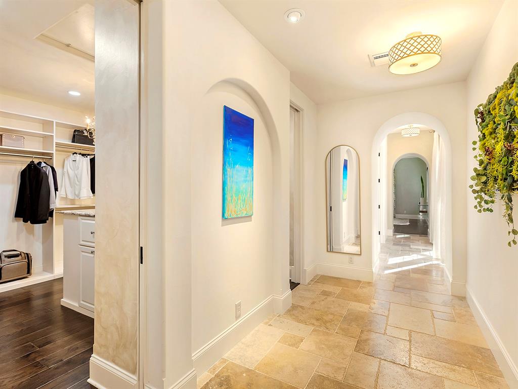 7951 Matera Court Lakewood Ranch, FL 34202 - Photo 35 of 81 a view of a hallway with wooden floor and living room