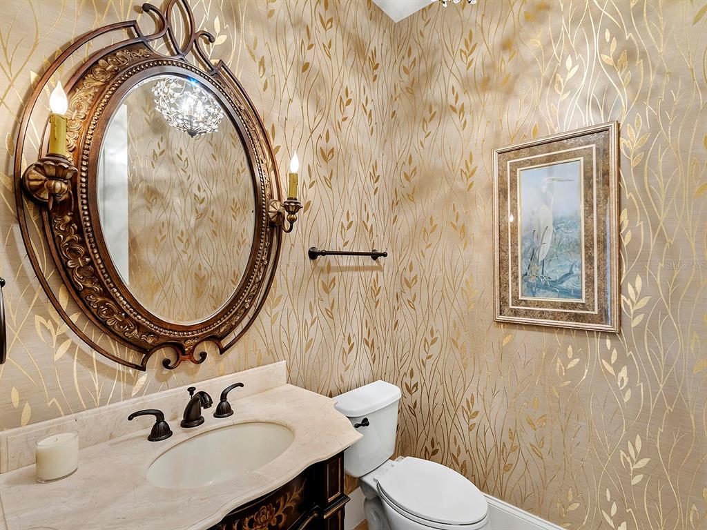 7951 Matera Court Lakewood Ranch, FL 34202 - Photo 40 of 81 a bathroom with a sink and a mirror