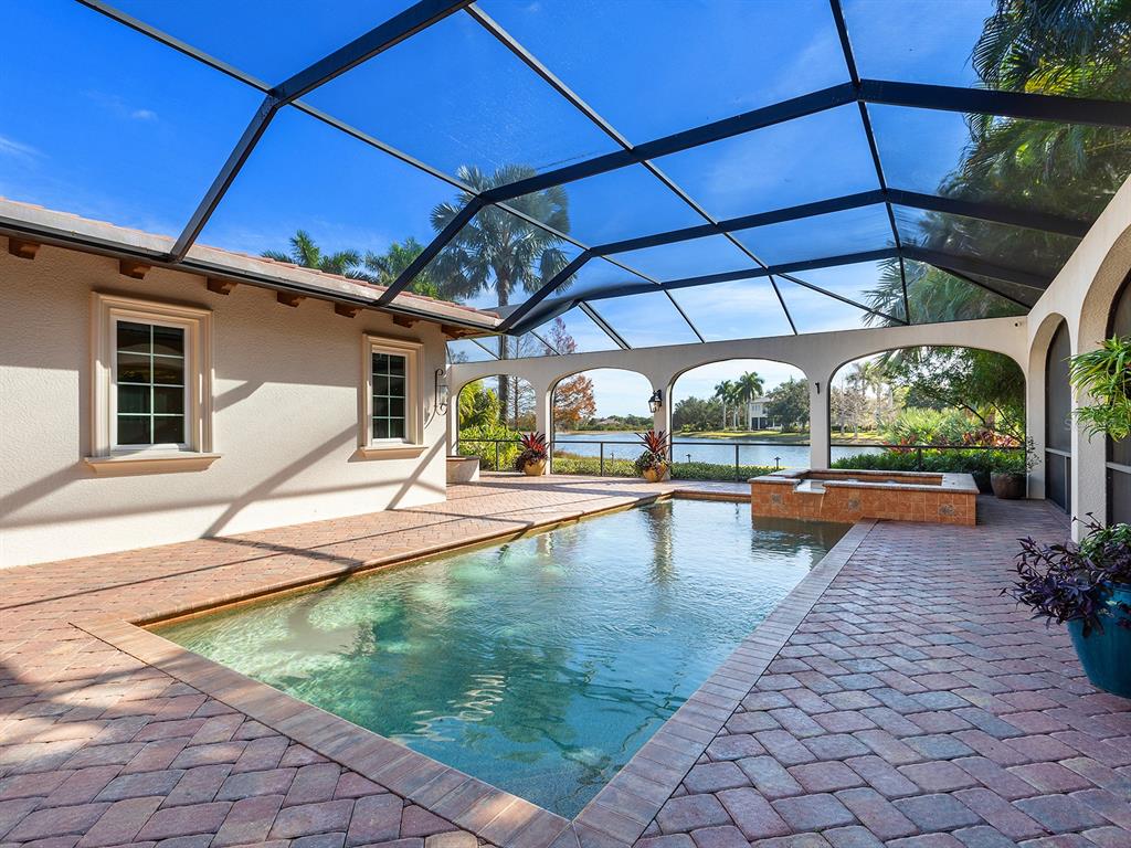 7951 Matera Court Lakewood Ranch, FL 34202 - Photo 55 of 81 a view of a swimming pool with a patio