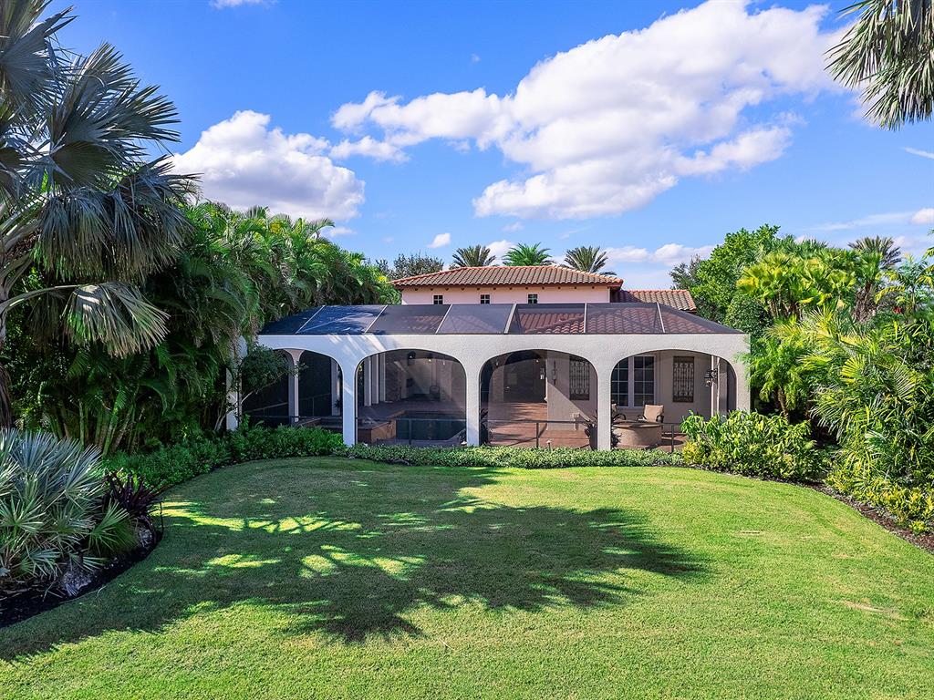 7951 Matera Court Lakewood Ranch, FL 34202 - Photo 58 of 81 a front view of house with yard and green space