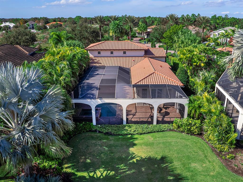 7951 Matera Court Lakewood Ranch, FL 34202 - Photo 59 of 81 an aerial view of a house with garden