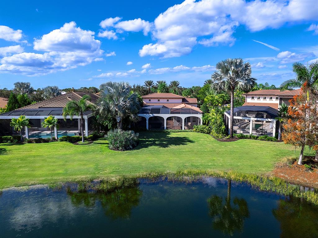 7951 Matera Court Lakewood Ranch, FL 34202 - Photo 60 of 81 a front view of a house with garden