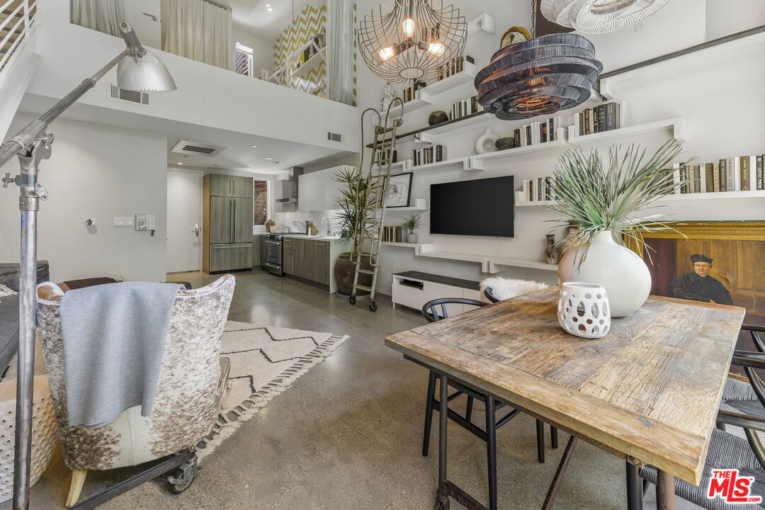 123 North Kings Road, Unit 11 Los Angeles, CA 90048 - Photo 1 of 27 a view of a dining room with furniture