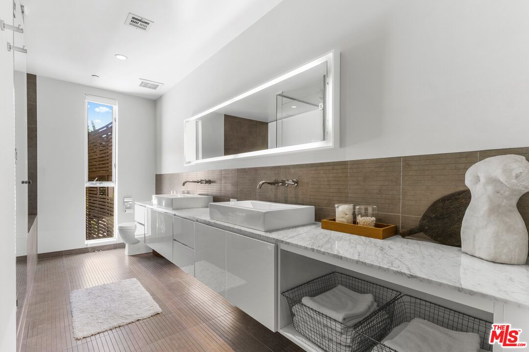 123 North Kings Road, Unit 11 Los Angeles, CA 90048 - Photo 16 of 27 a kitchen with a sink and a refrigerator