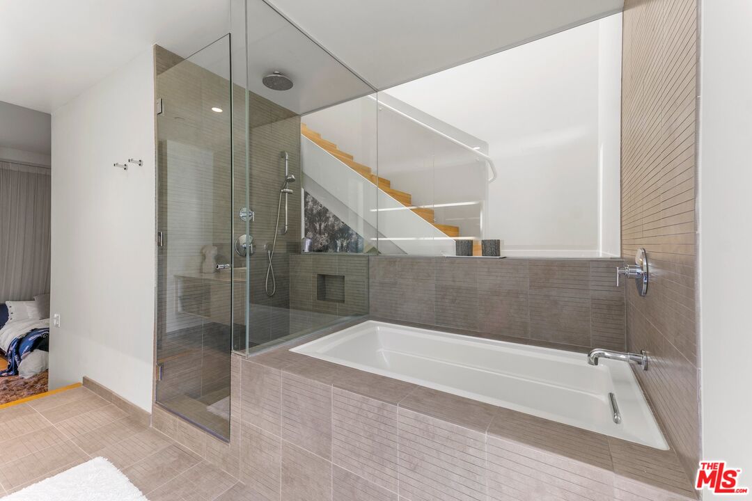 123 North Kings Road, Unit 11 Los Angeles, CA 90048 - Photo 17 of 27 a spacious bathroom with a tub shower and sink