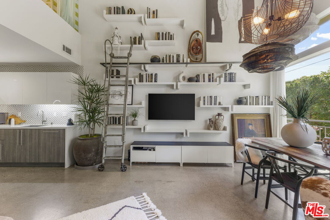 123 North Kings Road, Unit 11 Los Angeles, CA 90048 - Photo 2 of 27 a living room with furniture and a flat screen tv