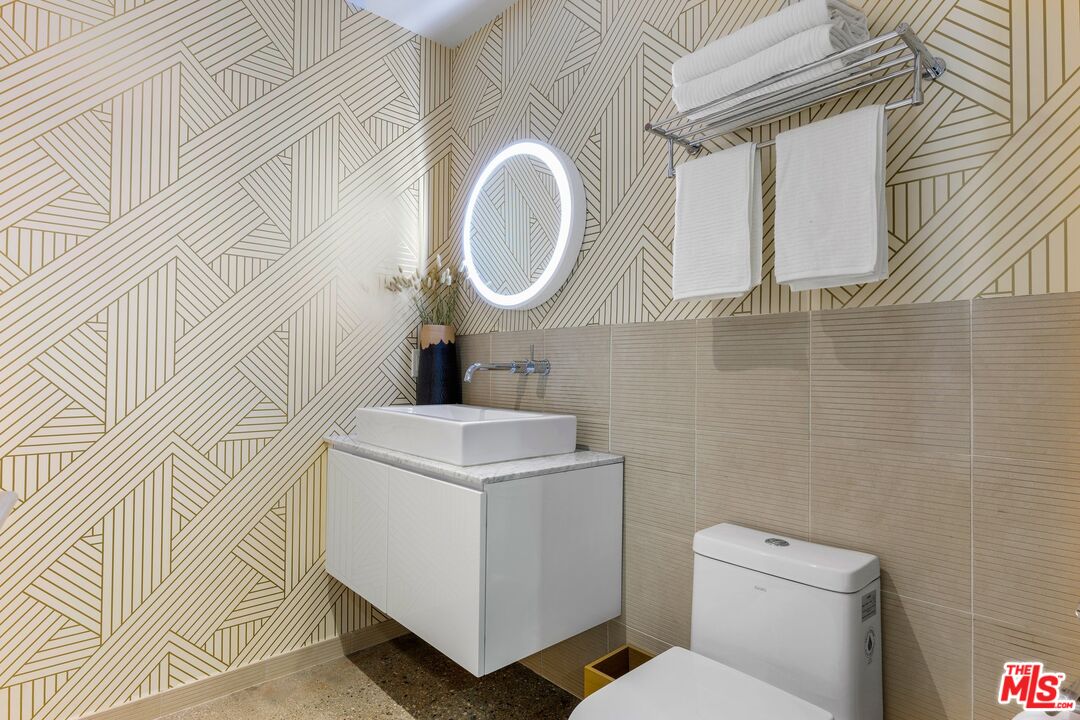 123 North Kings Road, Unit 11 Los Angeles, CA 90048 - Photo 10 of 27 a bathroom with a sink a toilet and a mirror