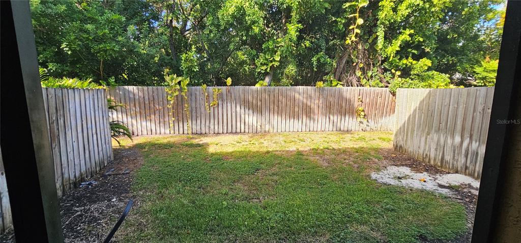 10167 Sailwinds Boulevard North, Unit 104 Largo, FL 33773 - Photo 3 of 3 a view of outdoor space and yard