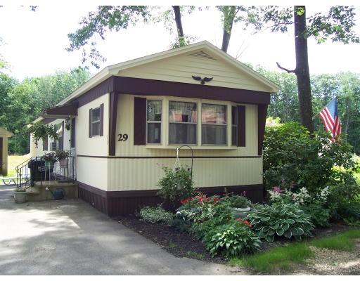 29 Lewis Street Rutland, MA 01543 - Photo 1 of 1 a front view of a house with a garden