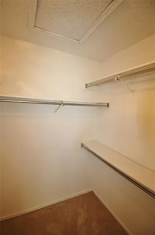 a view of a room with racks on the wall