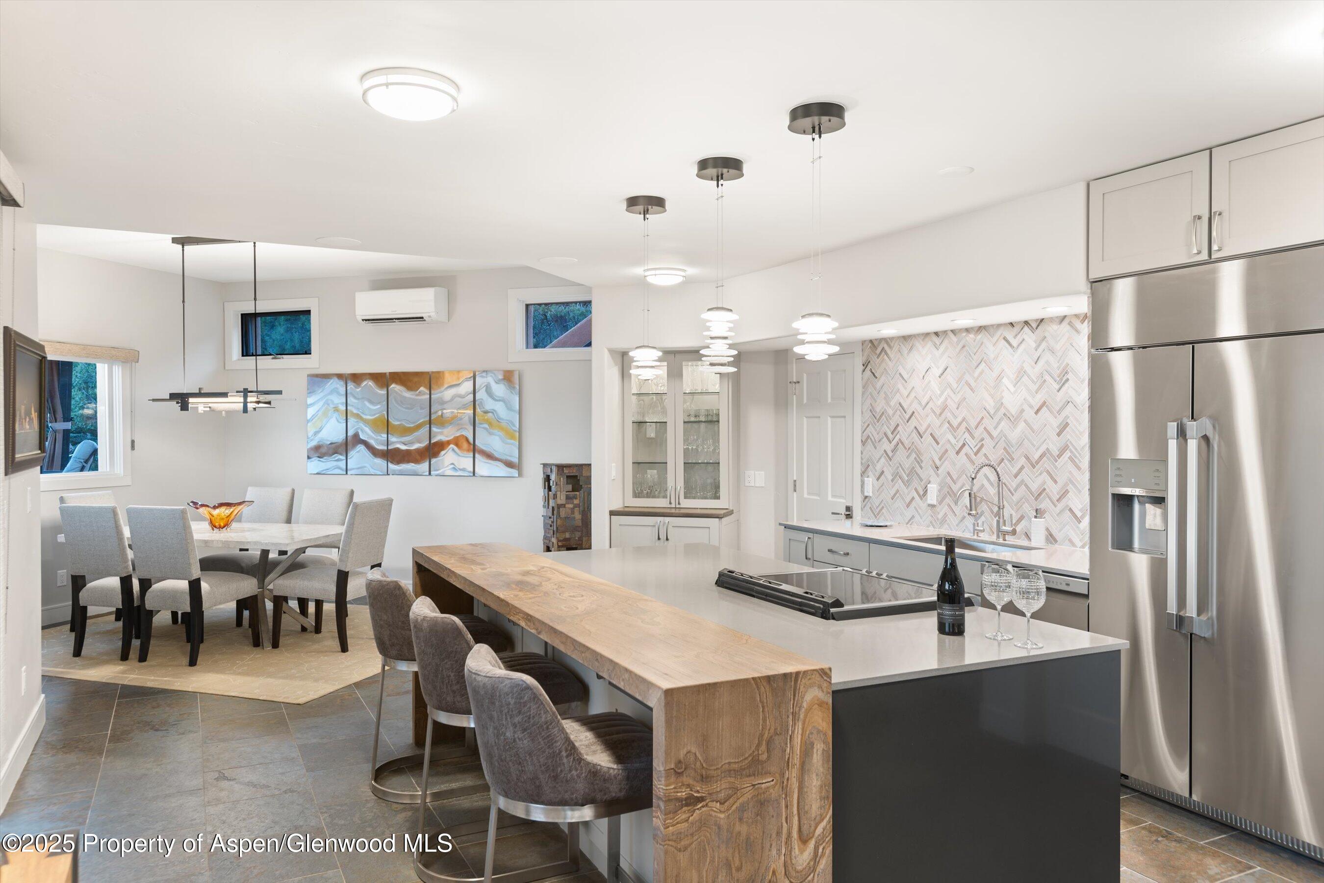 384 Wooden Deer Road Carbondale, CO 81623 - Photo 12 of 48 a large kitchen with a table and chairs