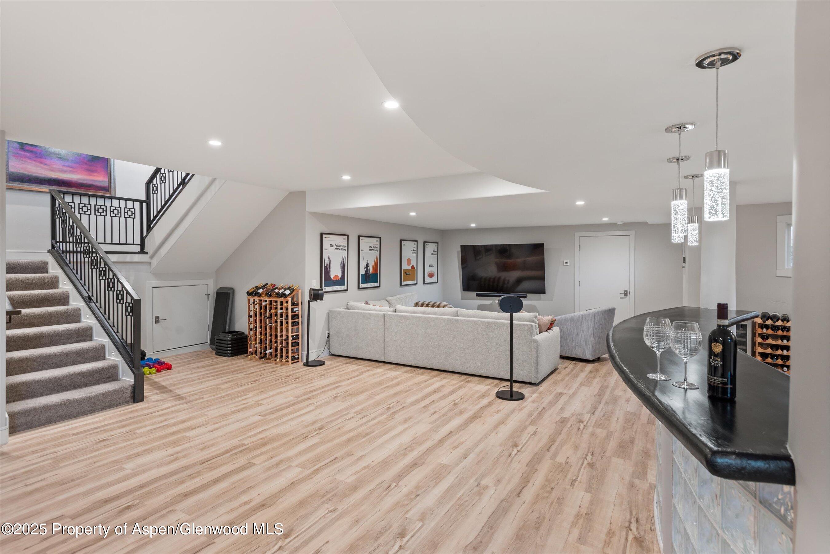 384 Wooden Deer Road Carbondale, CO 81623 - Photo 16 of 48 a living room with furniture and a flat screen tv