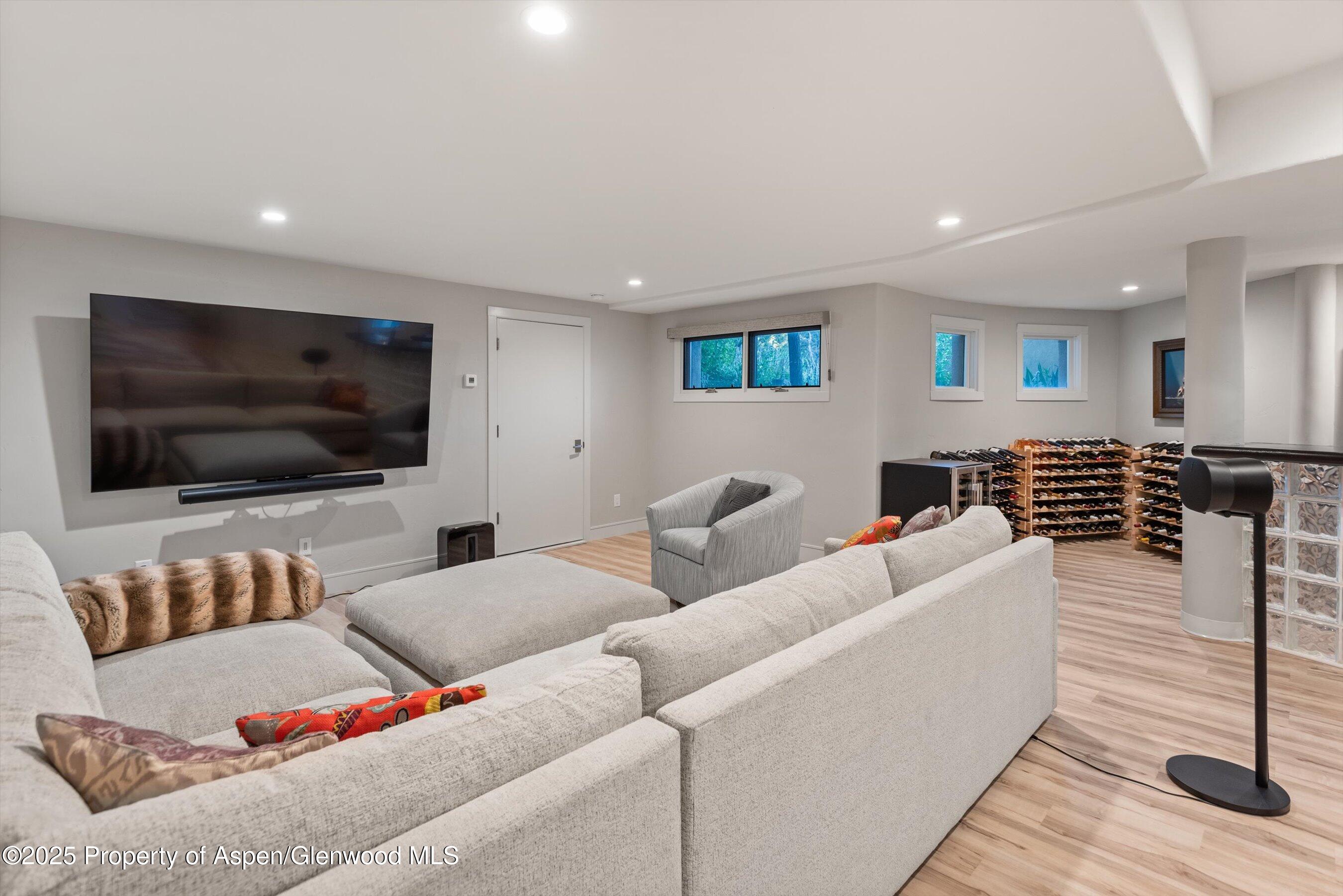 384 Wooden Deer Road Carbondale, CO 81623 - Photo 18 of 48 a living room with furniture and a flat screen tv