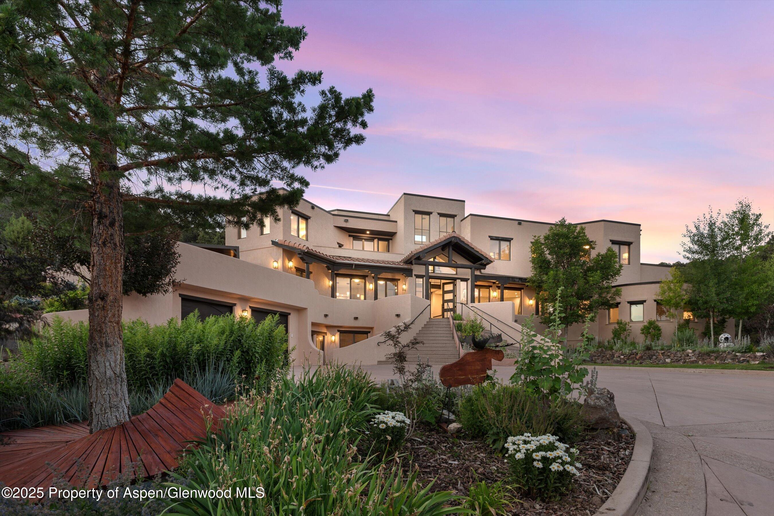 384 Wooden Deer Road Carbondale, CO 81623 - Photo 2 of 48 a view of a house with a yard and garden