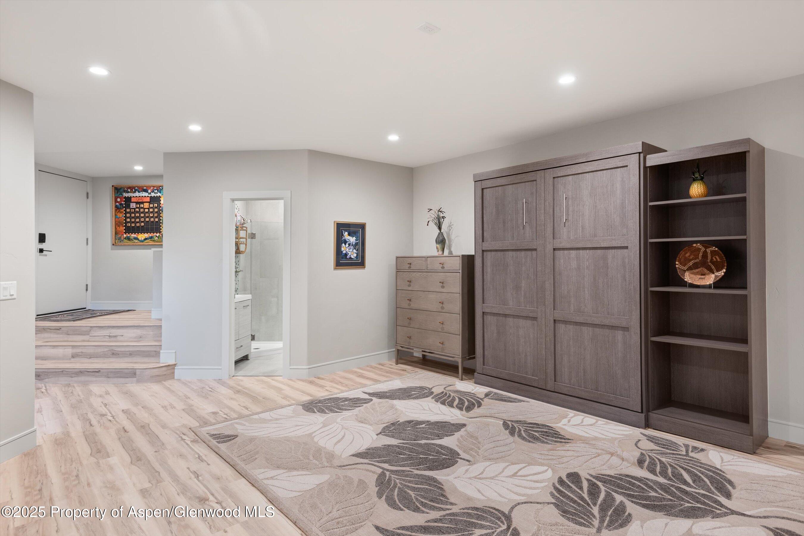 384 Wooden Deer Road Carbondale, CO 81623 - Photo 21 of 48 a bedroom with a bed and a walk in closet