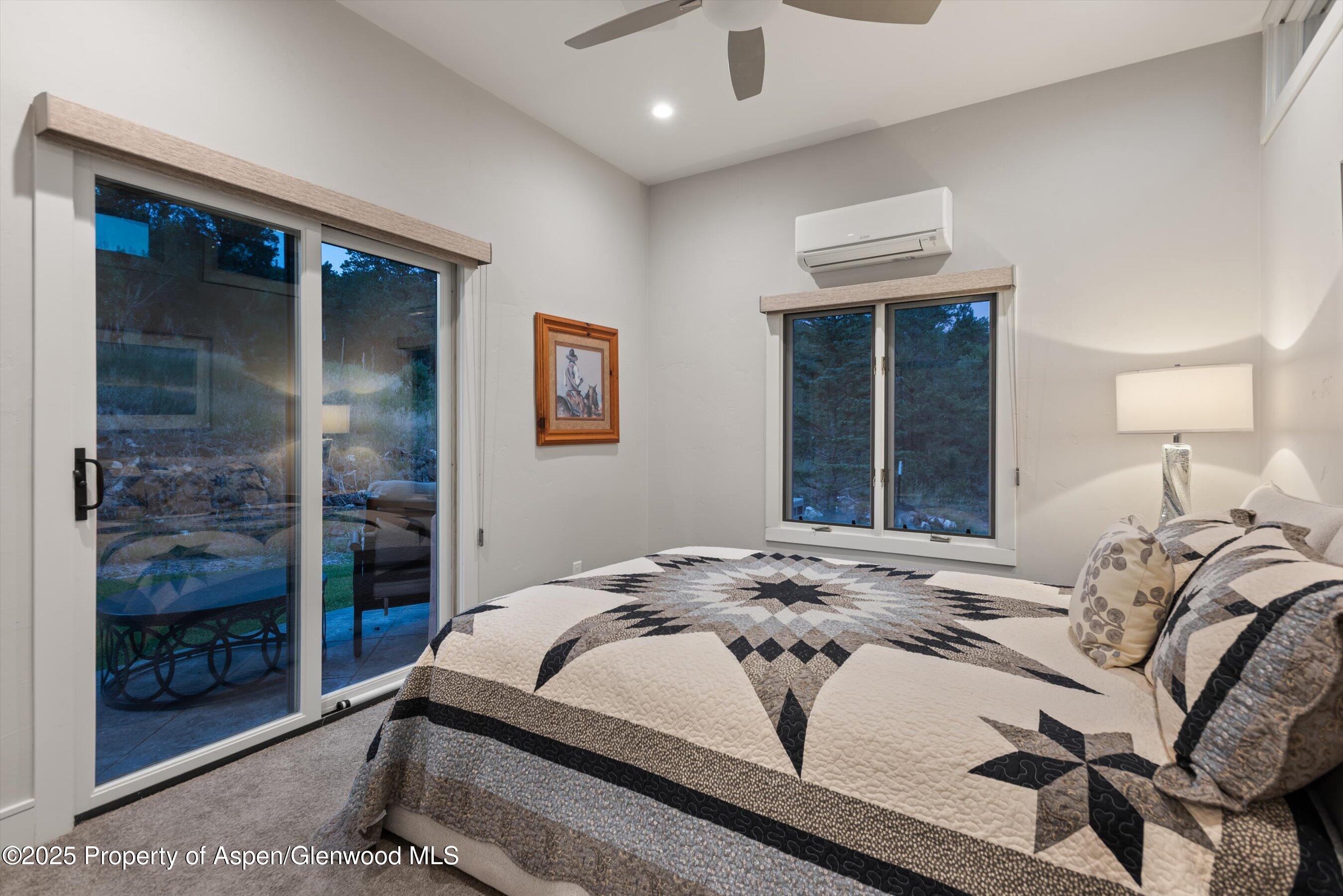 384 Wooden Deer Road Carbondale, CO 81623 - Photo 31 of 48 a bedroom with a bed and a window