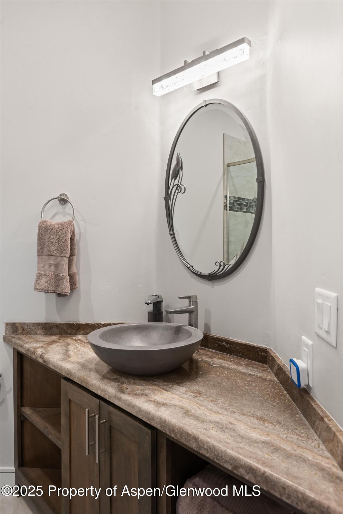 384 Wooden Deer Road Carbondale, CO 81623 - Photo 36 of 48 a bathroom with a sink and a mirror