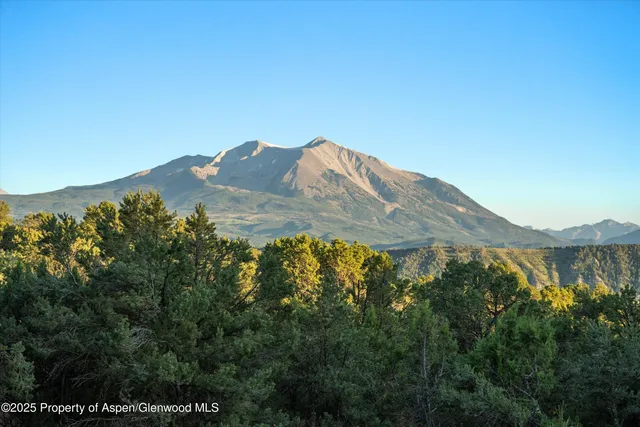 a view of mountains and valleys