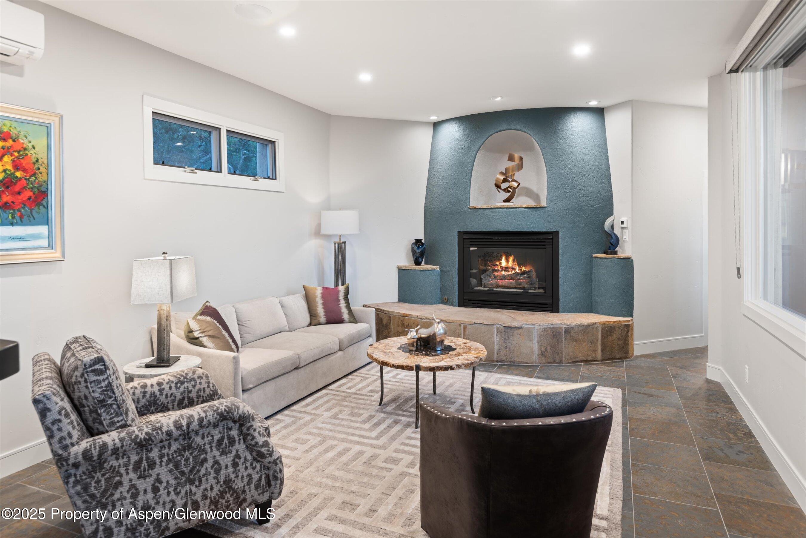 384 Wooden Deer Road Carbondale, CO 81623 - Photo 10 of 48 a living room with furniture and a fireplace