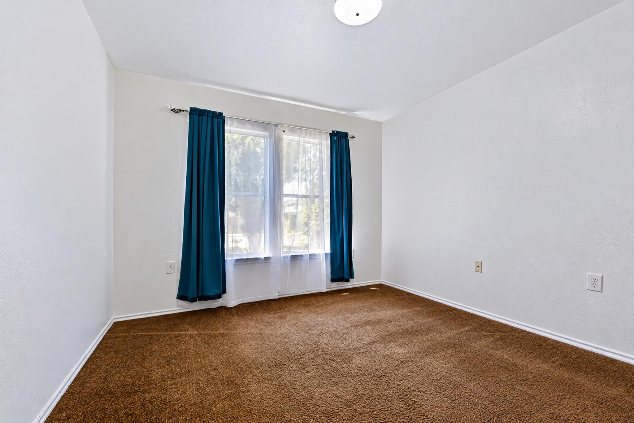 7317 Marble Ridge Drive Austin, TX 78747 - Photo 22 of 30 A wide window illuminates this versatile space featuring plush carpeting.