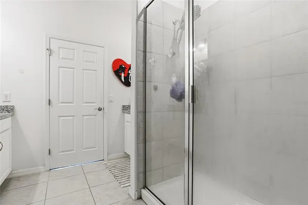 a bathroom with a shower and a sink
