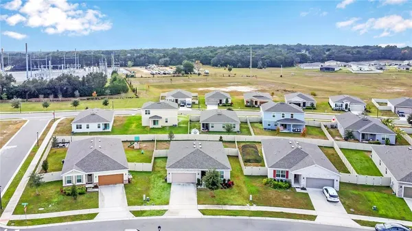 a view of houses with outdoor space and swimming pool