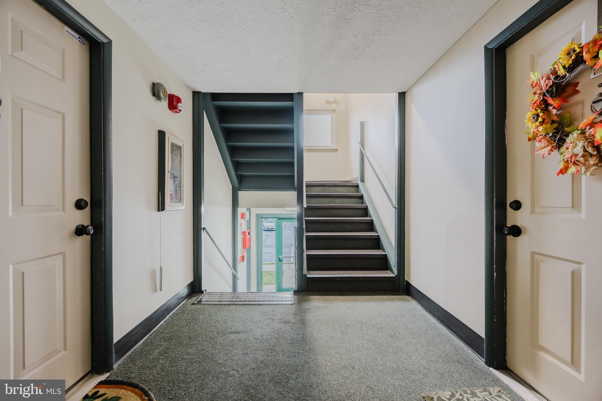 19621 Gunners Branch Road, Unit 823 Germantown, MD 20876 - Photo 13 of 49 a view of hallway with stairs and a living room