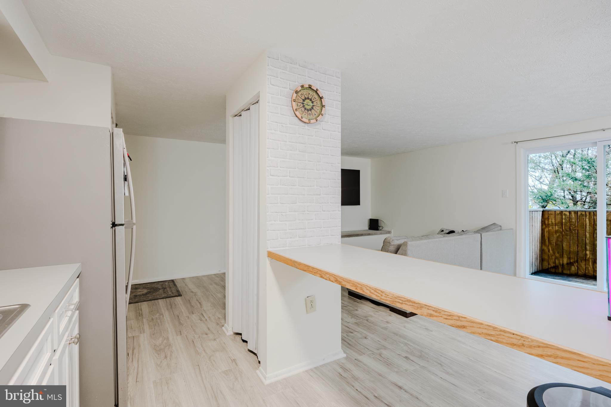 19621 Gunners Branch Road, Unit 823 Germantown, MD 20876 - Photo 27 of 49 a view of a kitchen with two sink and a refrigerator