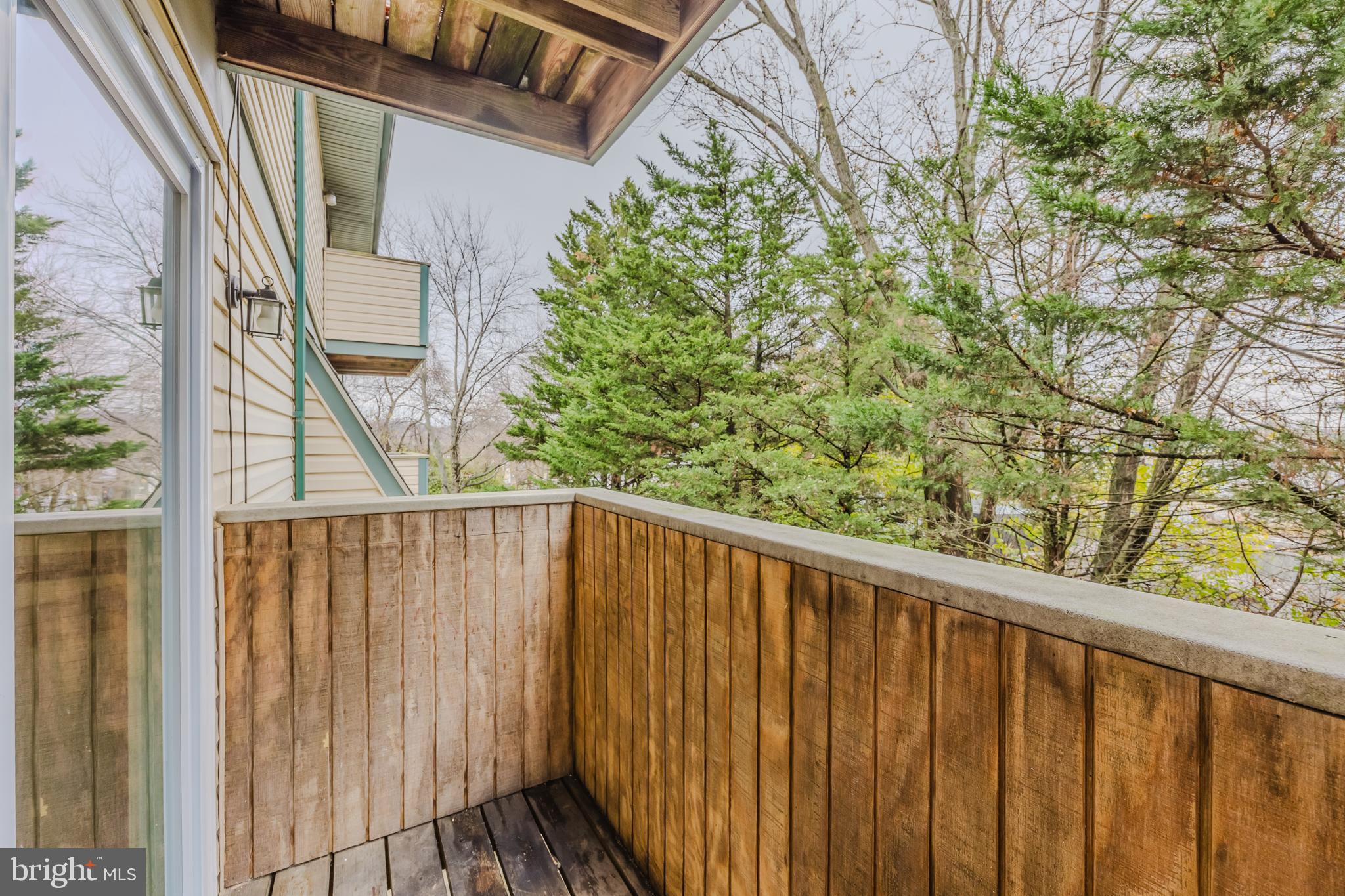 19621 Gunners Branch Road, Unit 823 Germantown, MD 20876 - Photo 29 of 49 a view of balcony with wooden floor