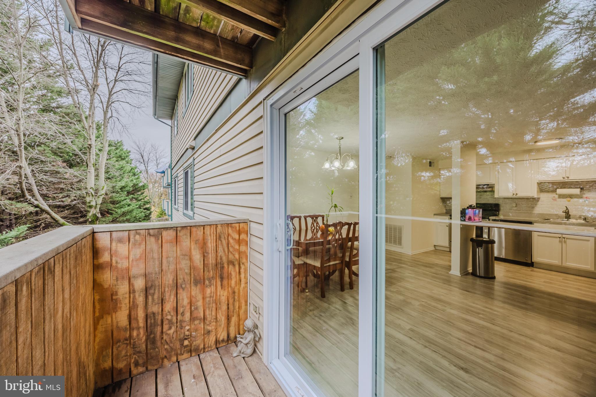 19621 Gunners Branch Road, Unit 823 Germantown, MD 20876 - Photo 30 of 49 a view of kitchen with furniture and wooden floor