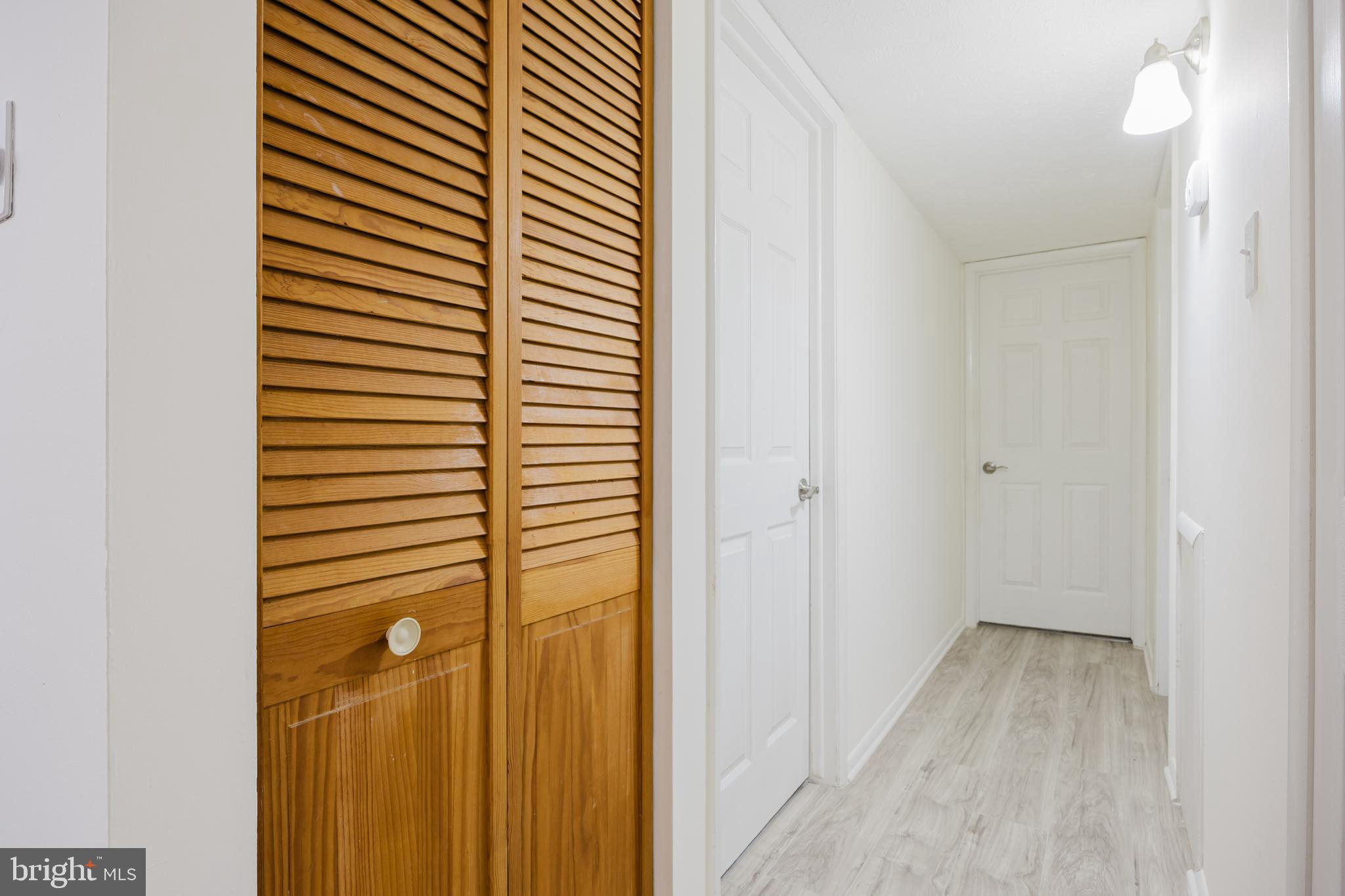 19621 Gunners Branch Road, Unit 823 Germantown, MD 20876 - Photo 33 of 49 a view of a bathroom from a hallway
