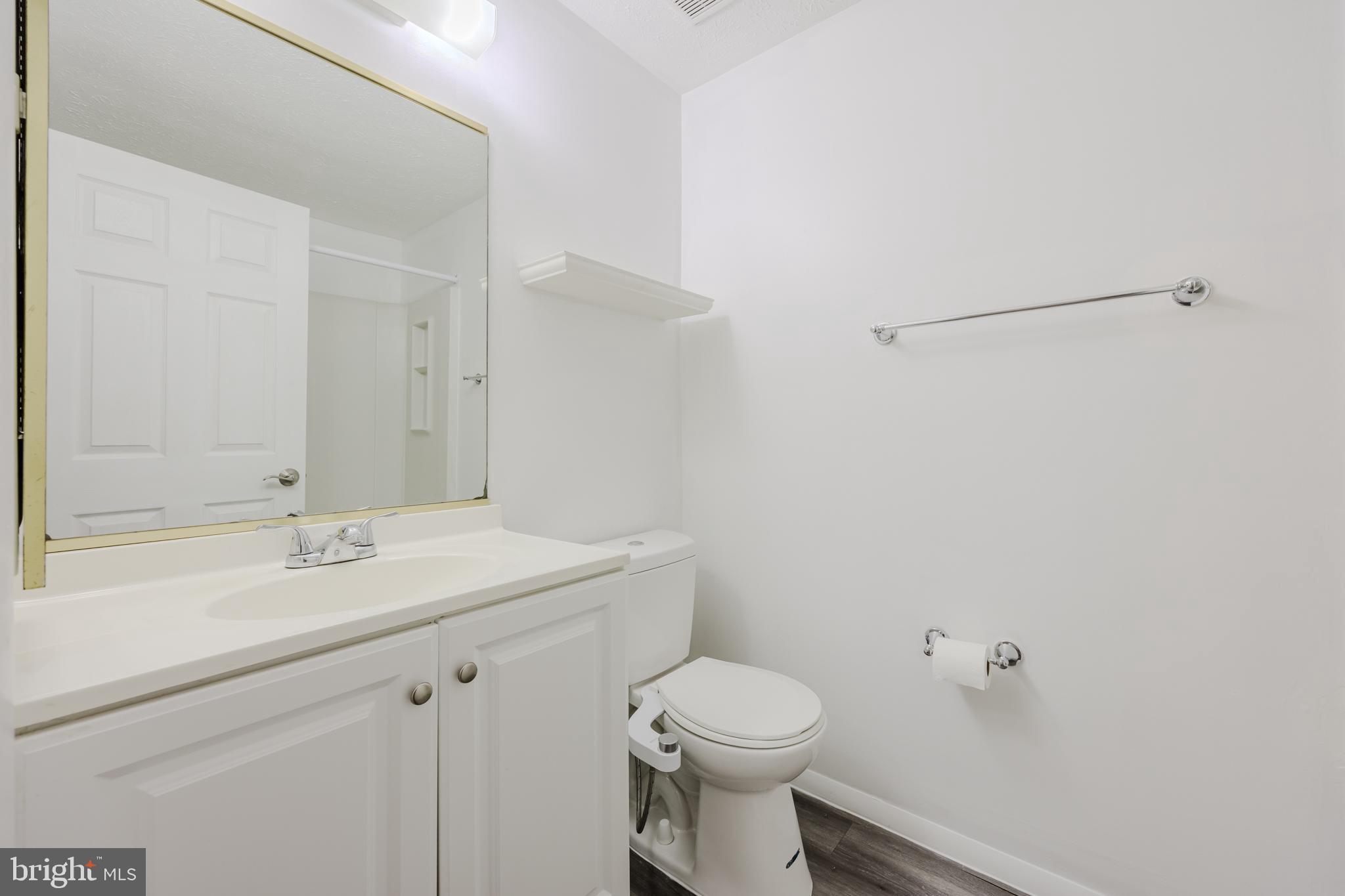 19621 Gunners Branch Road, Unit 823 Germantown, MD 20876 - Photo 34 of 49 a bathroom with a sink a toilet and vanity