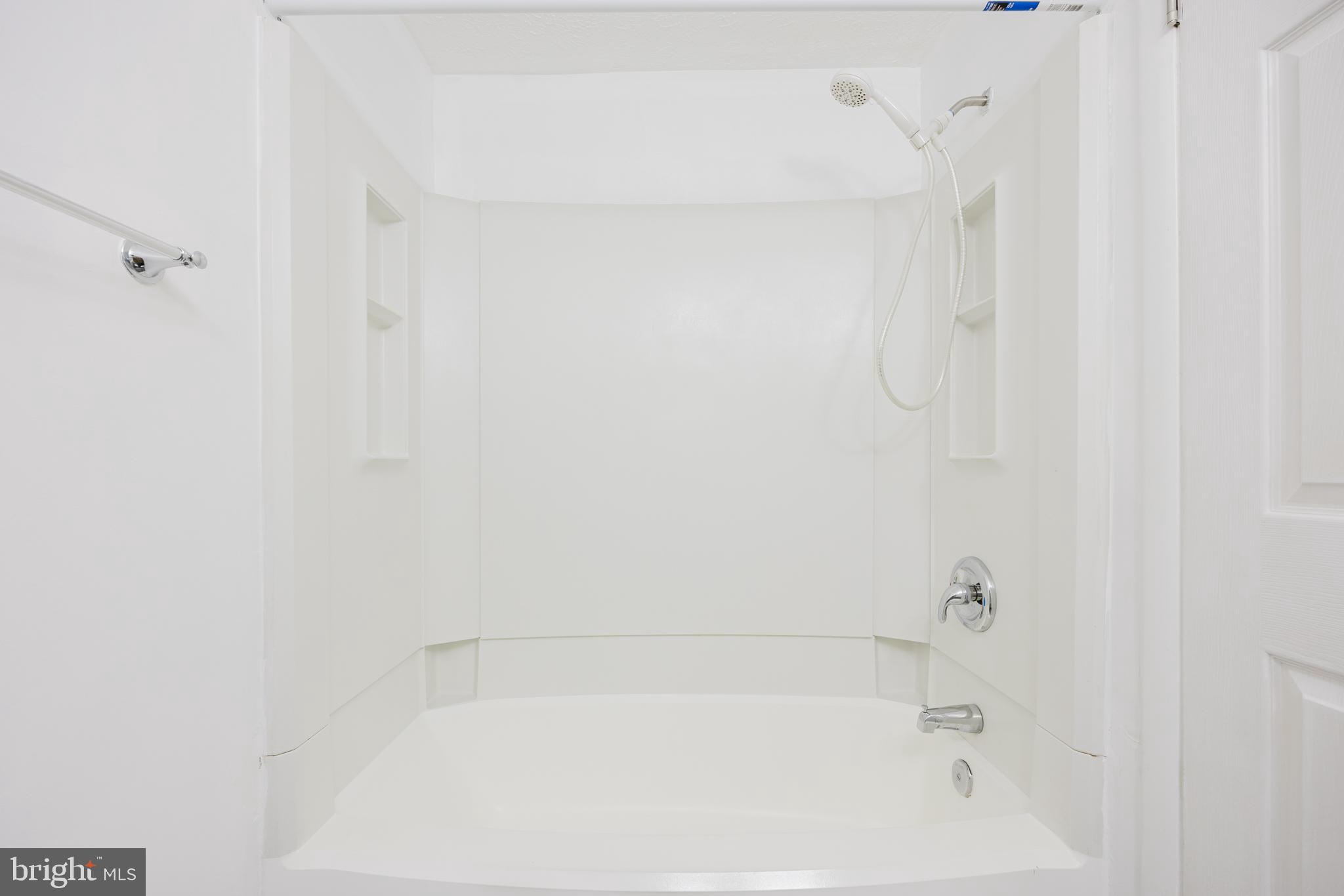 19621 Gunners Branch Road, Unit 823 Germantown, MD 20876 - Photo 35 of 49 a close up of a bathtub