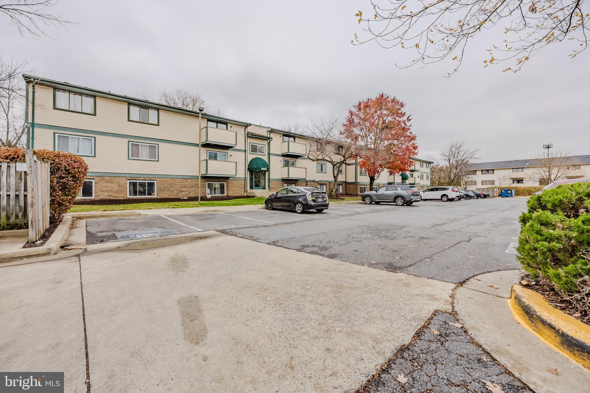 19621 Gunners Branch Road, Unit 823 Germantown, MD 20876 - Photo 4 of 49 a cars parked in front of a building