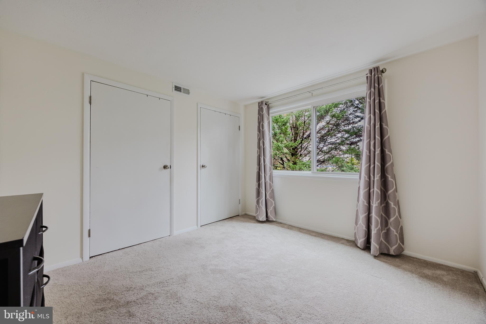 19621 Gunners Branch Road, Unit 823 Germantown, MD 20876 - Photo 42 of 49 a view of an empty room with a window