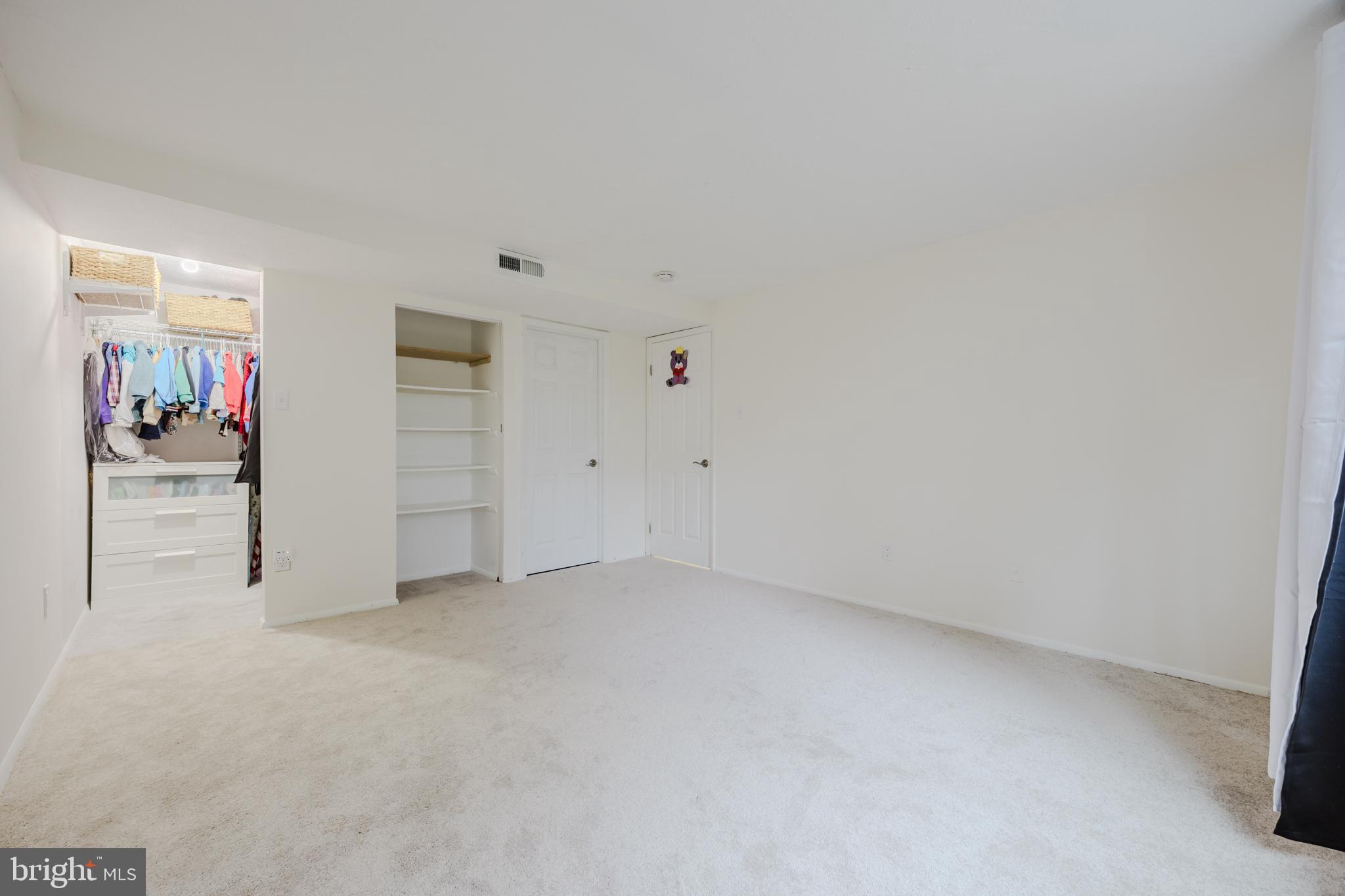 19621 Gunners Branch Road, Unit 823 Germantown, MD 20876 - Photo 44 of 49 an empty room with closet