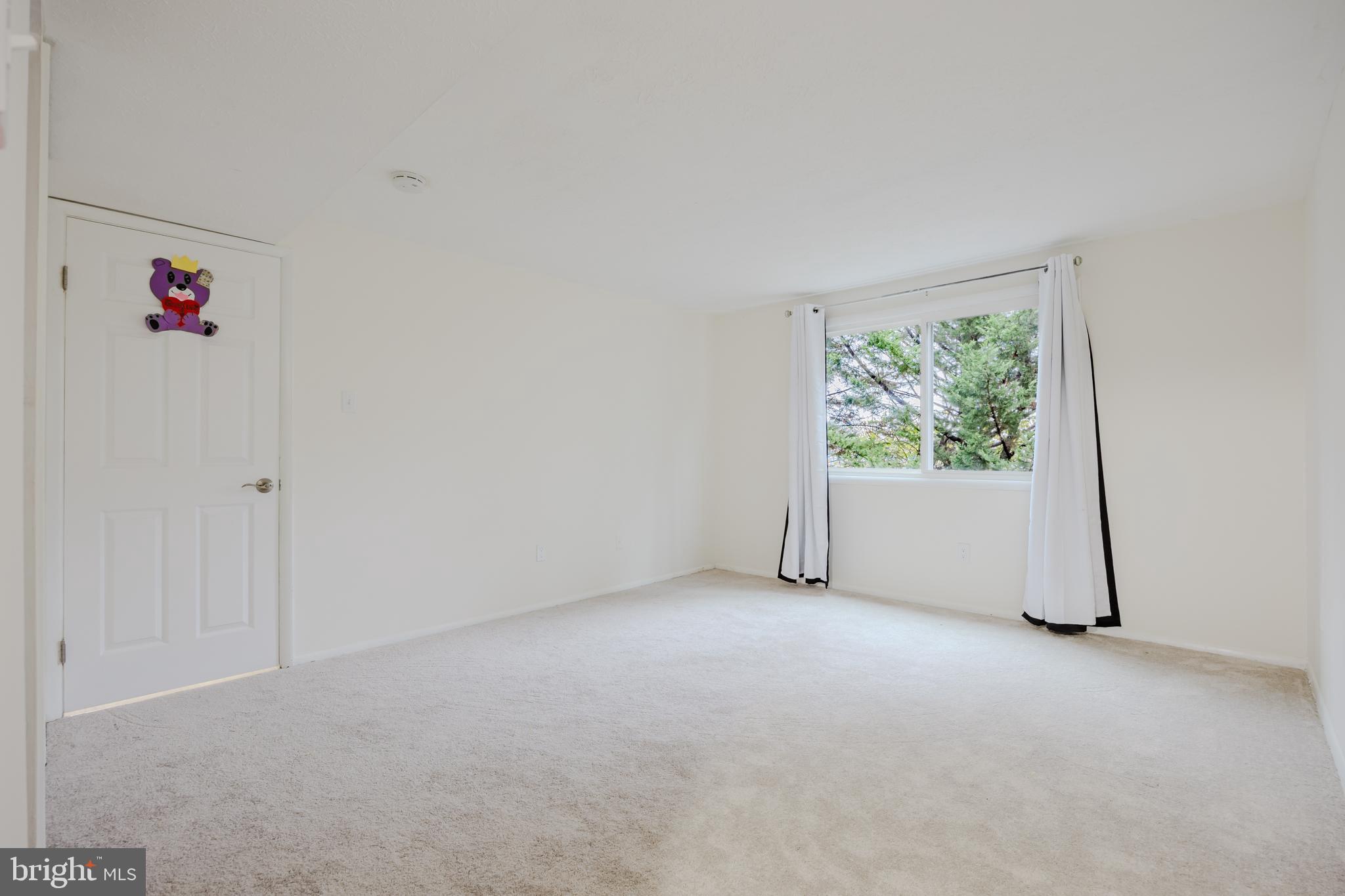 19621 Gunners Branch Road, Unit 823 Germantown, MD 20876 - Photo 45 of 49 a view of an empty room and window