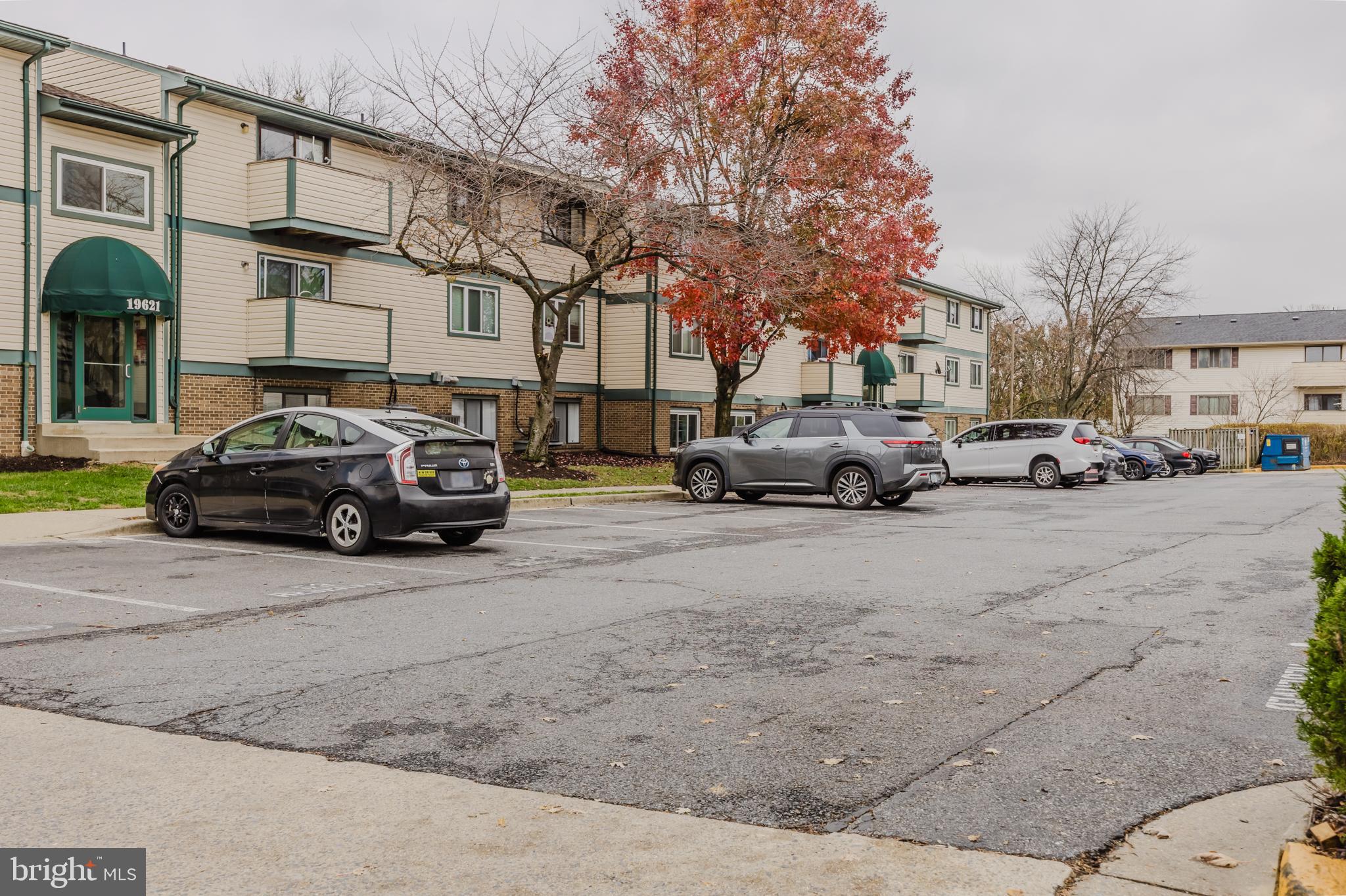 19621 Gunners Branch Road, Unit 823 Germantown, MD 20876 - Photo 5 of 49 a view of a cars park in front of a building