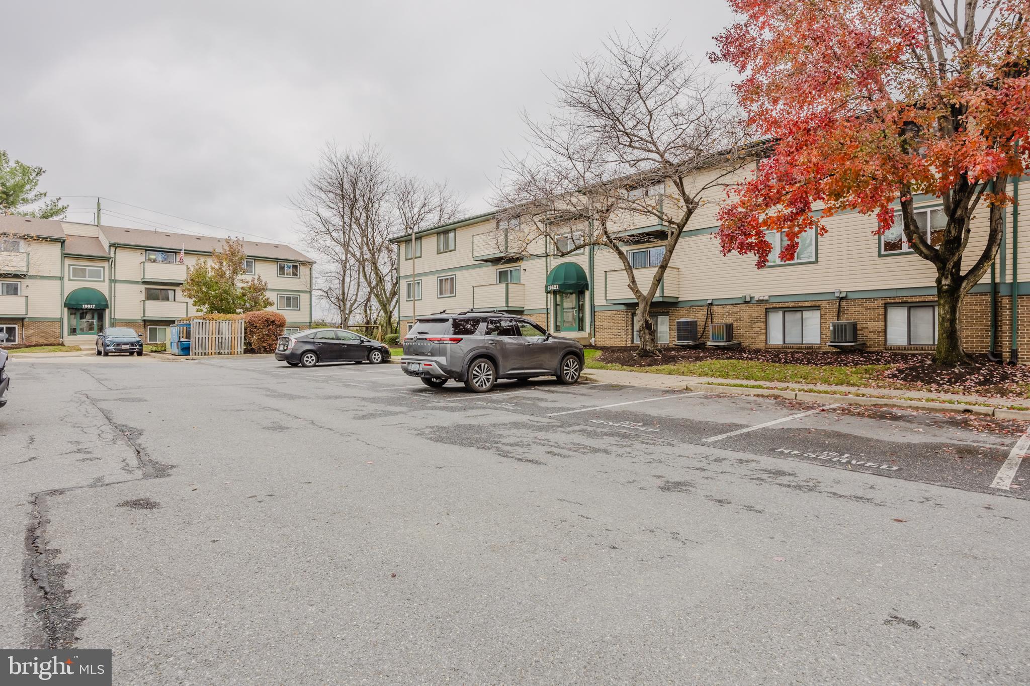 19621 Gunners Branch Road, Unit 823 Germantown, MD 20876 - Photo 6 of 49 a building with trees in front of it
