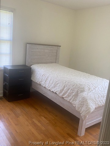 14 Richardson Road Bladenboro, NC 28320 - Photo 4 of 9 a bedroom with a bed and a night stand