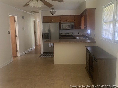 14 Richardson Road Bladenboro, NC 28320 - Photo 6 of 9 a kitchen with stainless steel appliances a refrigerator and a microwave