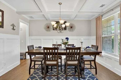 a view of a dining room with furniture window and outside view