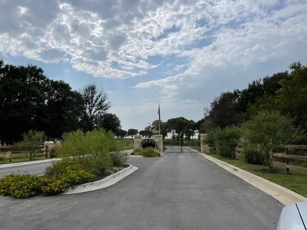 a view of a road with a yard