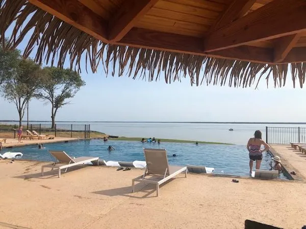 a view of a swimming pool and lounge chair