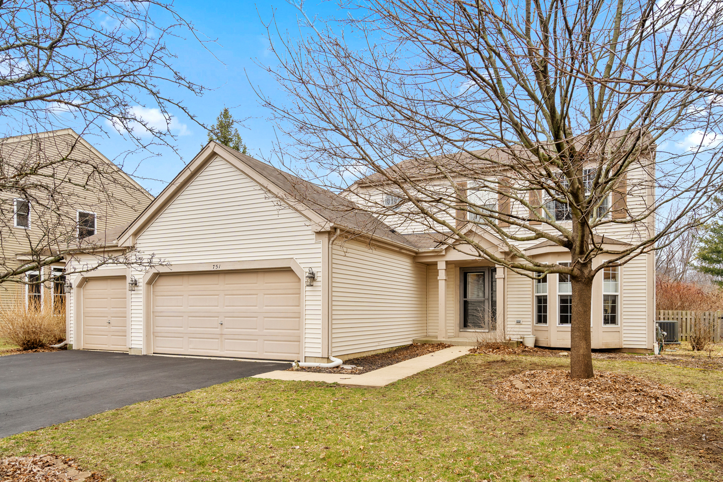 751 Sumac Drive Aurora, IL 60506 - Photo 1 of 33 a front view of a house with a yard and garage