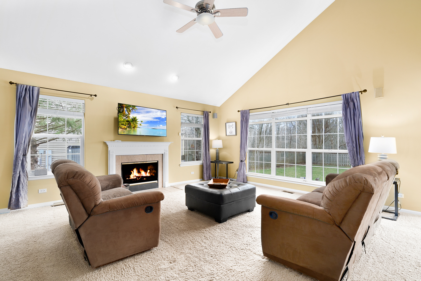 751 Sumac Drive Aurora, IL 60506 - Photo 14 of 33 a living room with furniture a fireplace and a large window