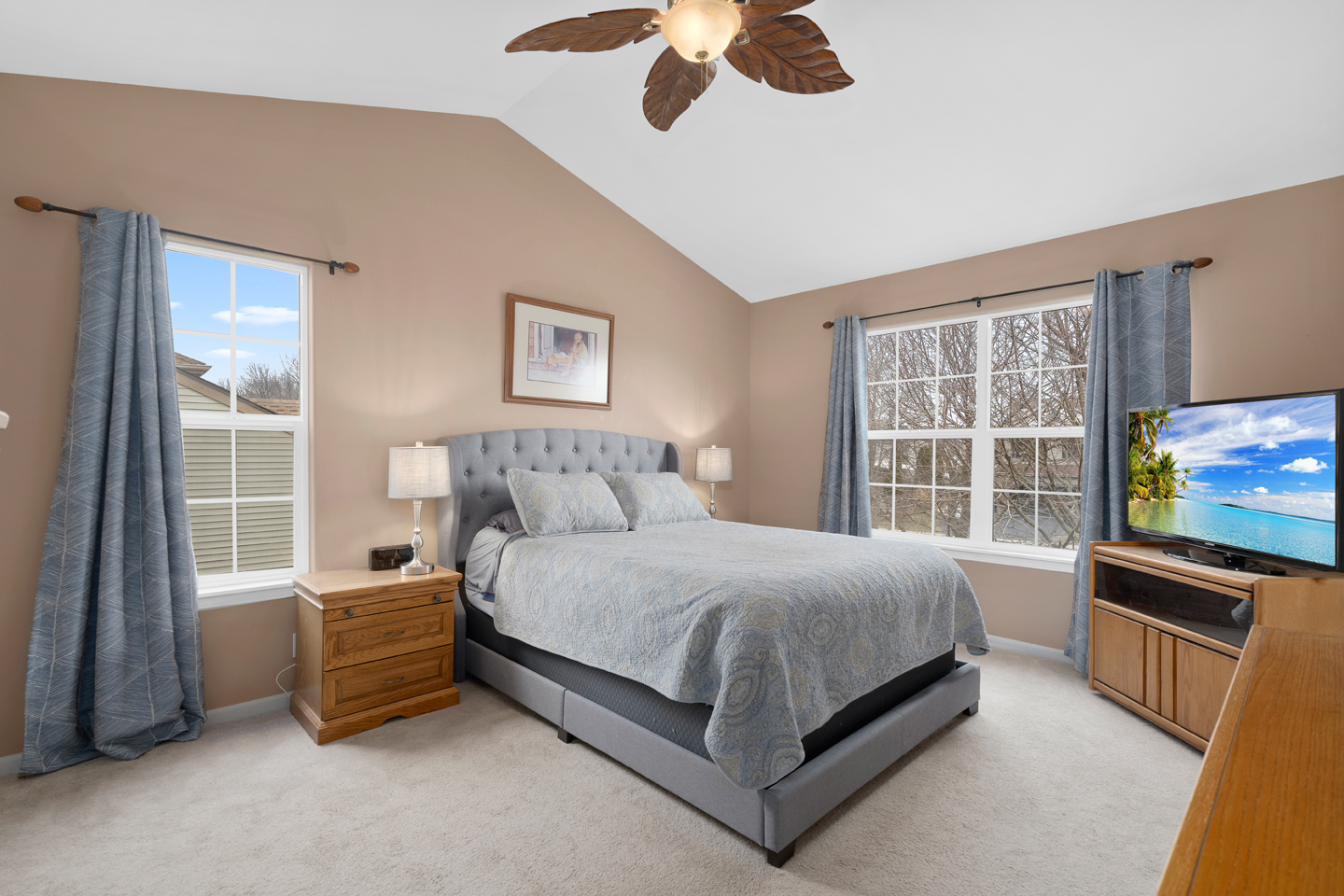 751 Sumac Drive Aurora, IL 60506 - Photo 19 of 33 a bedroom with a bed and a flat tv screen on dresser